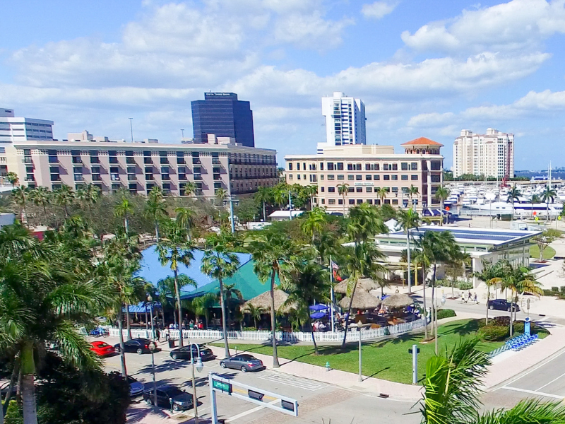 The plaza in West Palm Beach with palms and downtown skyline